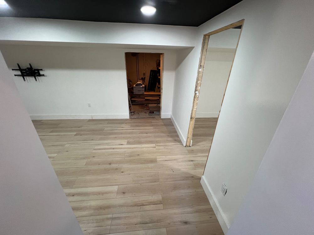 Basement with Black Ceiling and Grey Bath