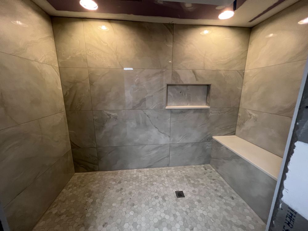 Basement with Black Ceiling and Grey Bath