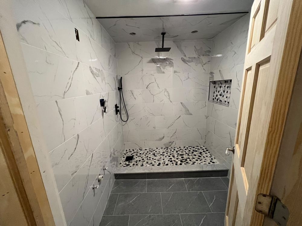 Marble Baths with Pebble Shower Floors
