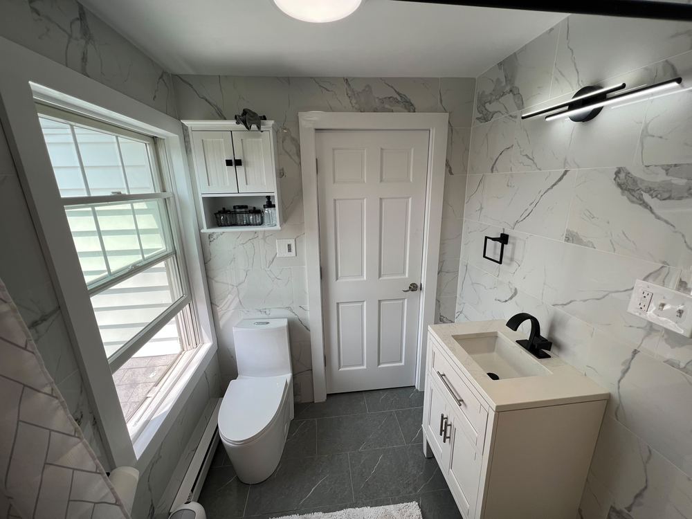 Marble Baths with Pebble Shower Floors