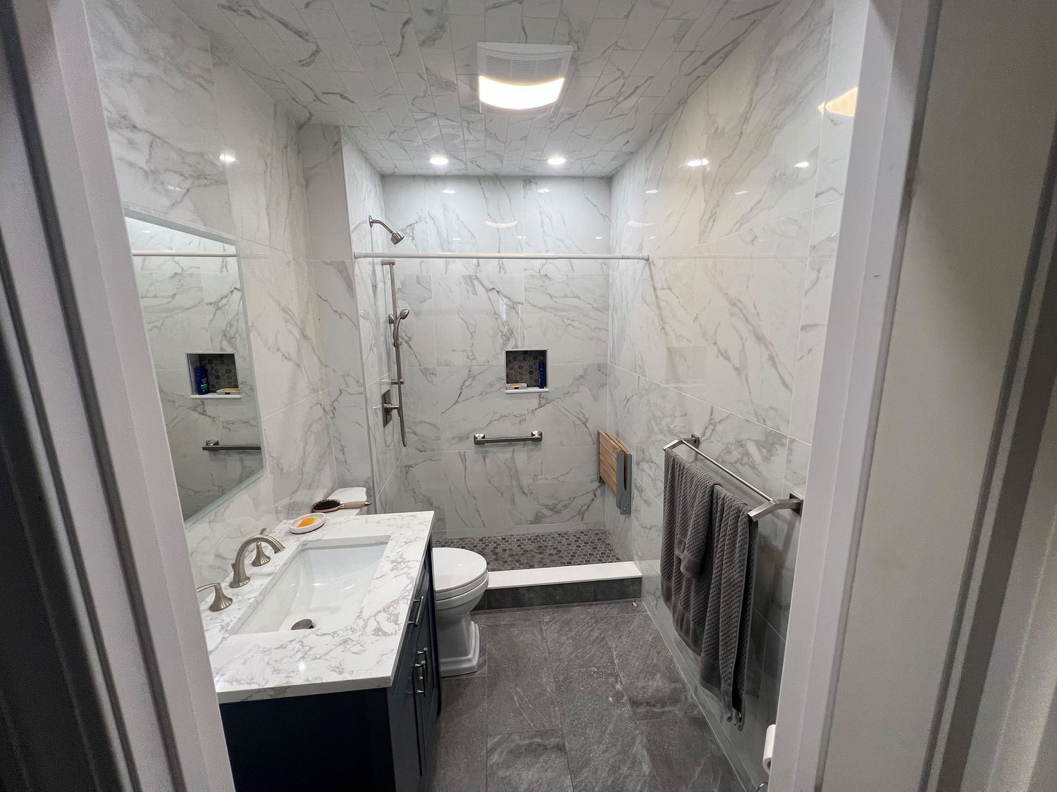 Marble Bath with Navy Vanity